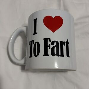 Coffee Mug “I Love To Fart”  Gag Gift Mug Ceramic, 22 oz. Spencer Gifts  4.5”H